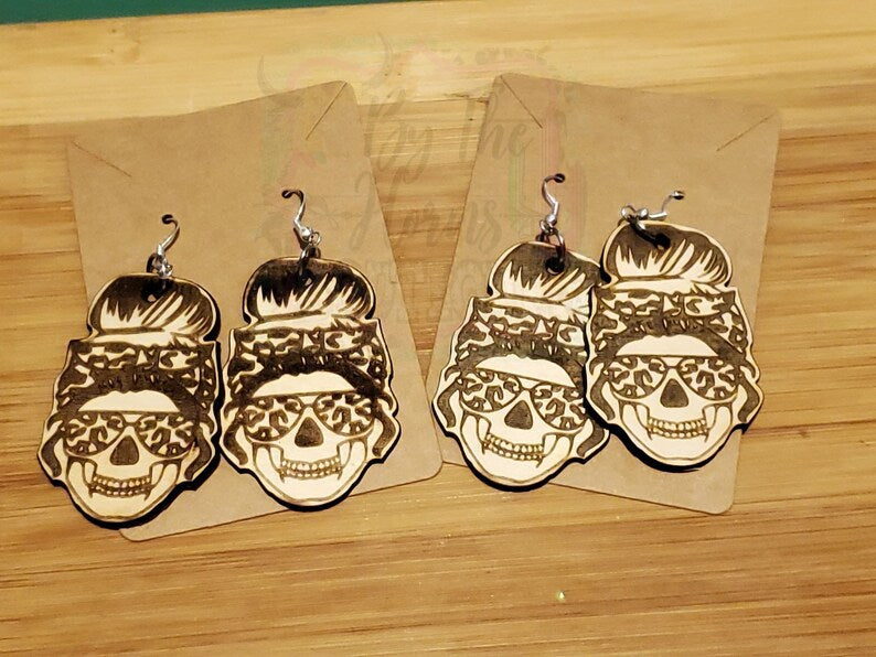 Messy bun leopard skull earrings